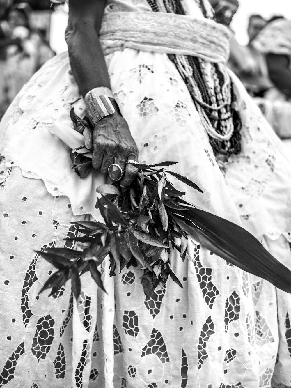 a black and white photo of a woman in a dress