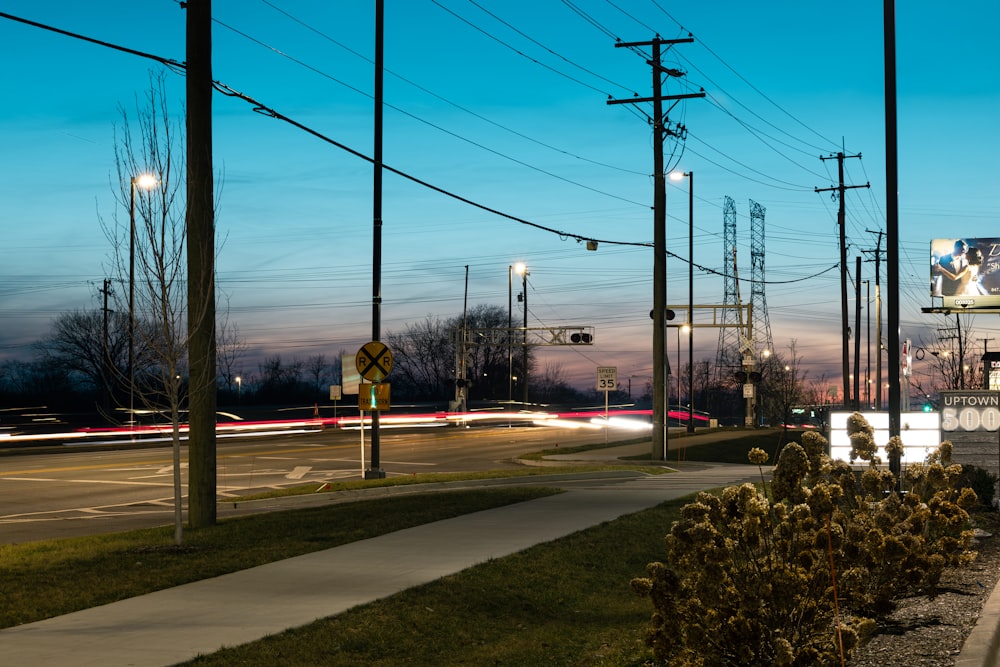 a city street at night with a traffic light