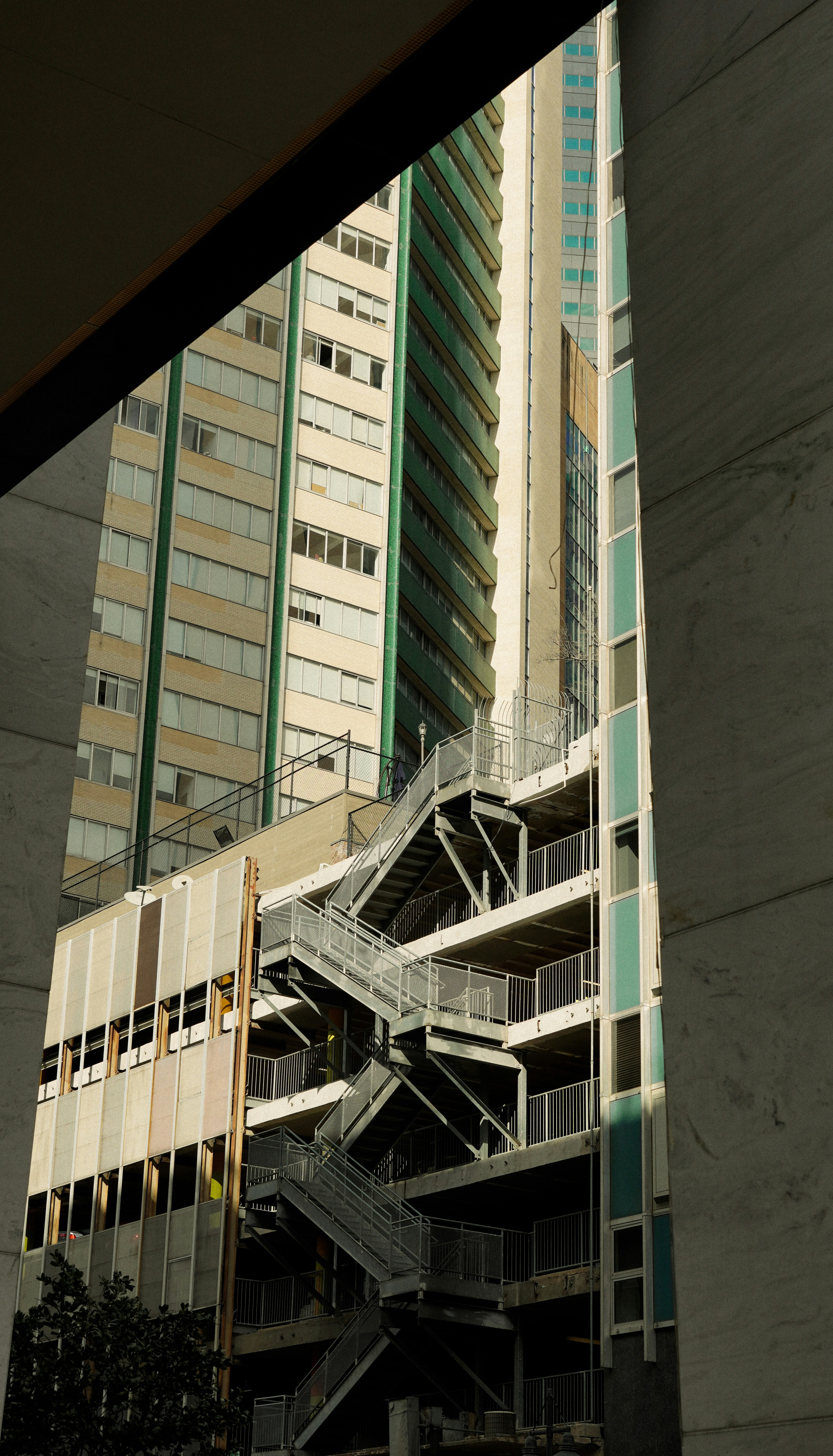 a very tall building next to a very tall building