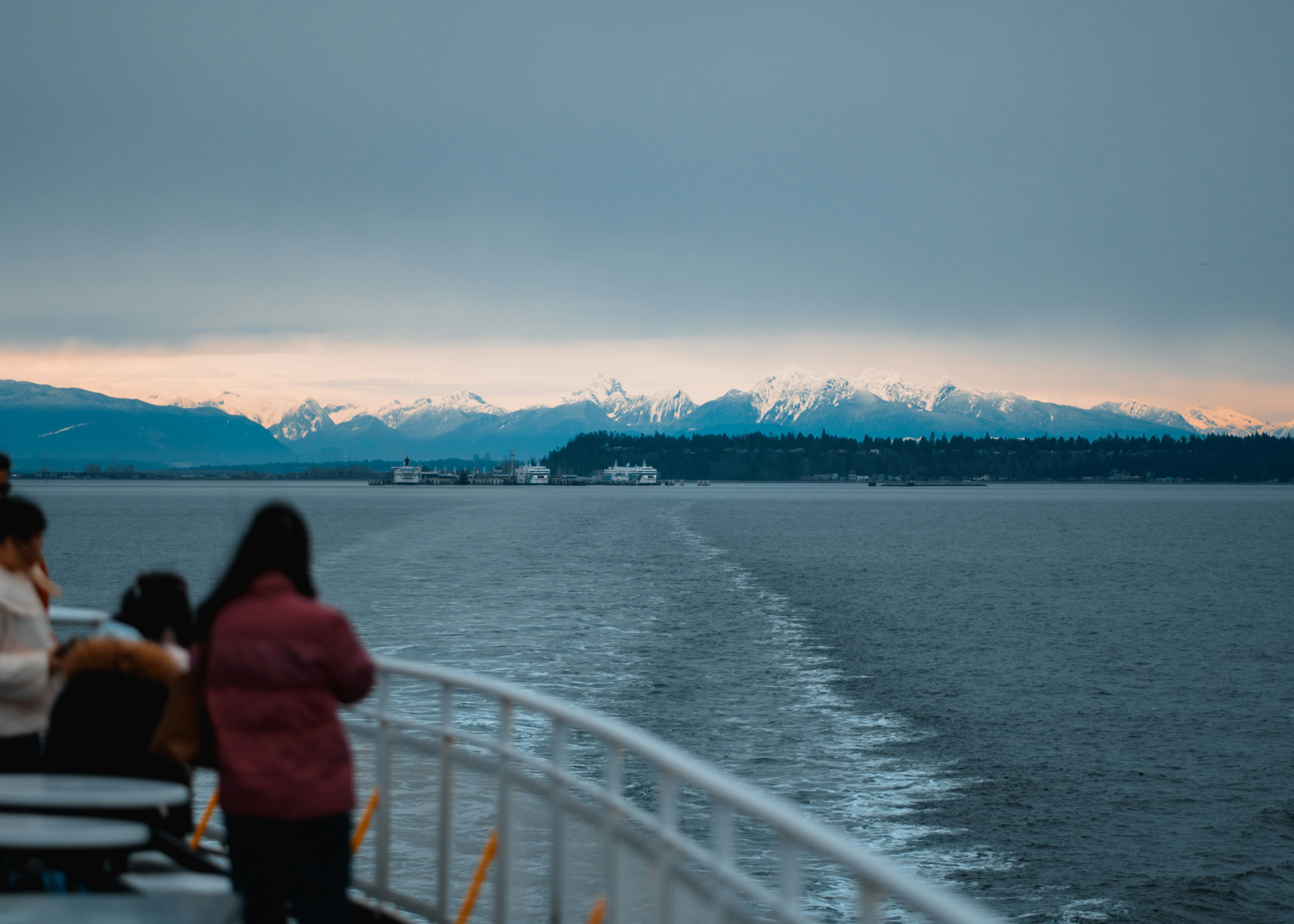 a group of people sitting on top of a boat
