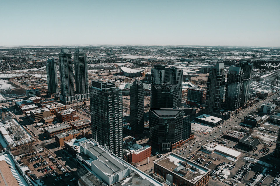 Tall glass and concrete buildings dominate the urban landscape from an aerial view