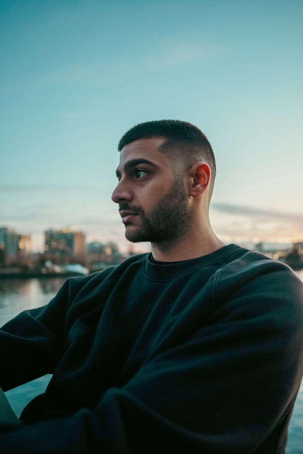 a man with a beard sitting on a boat