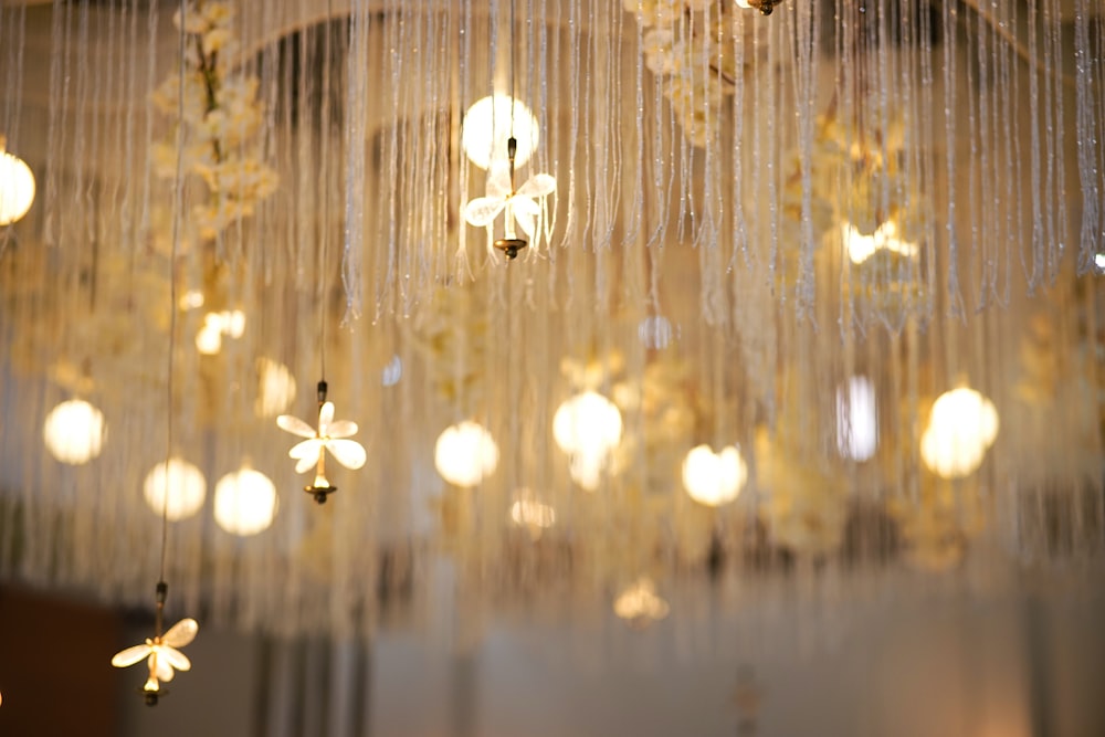 a chandelier hanging from a ceiling covered in lights