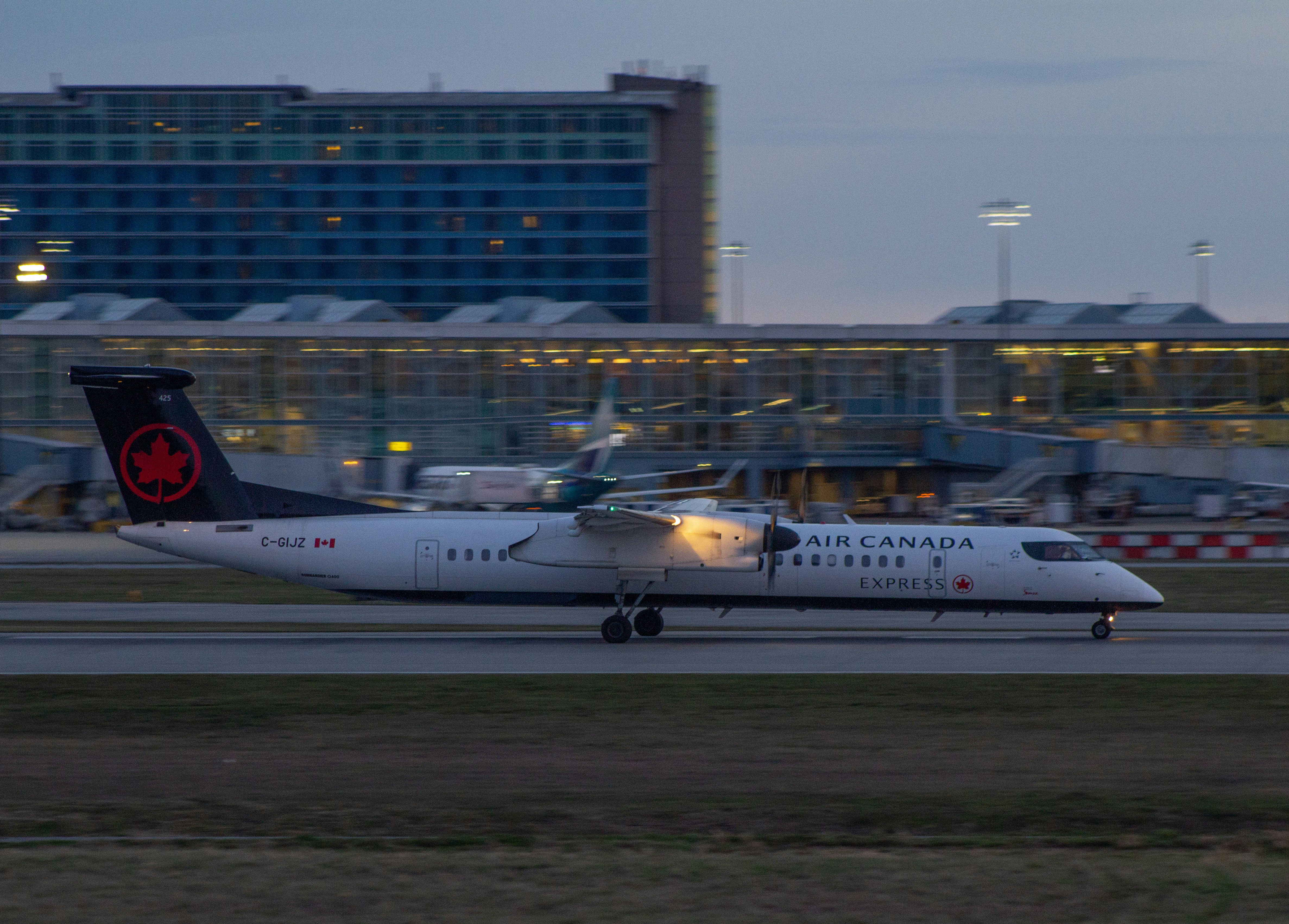 a large jetliner sitting on top of an airport runway, 