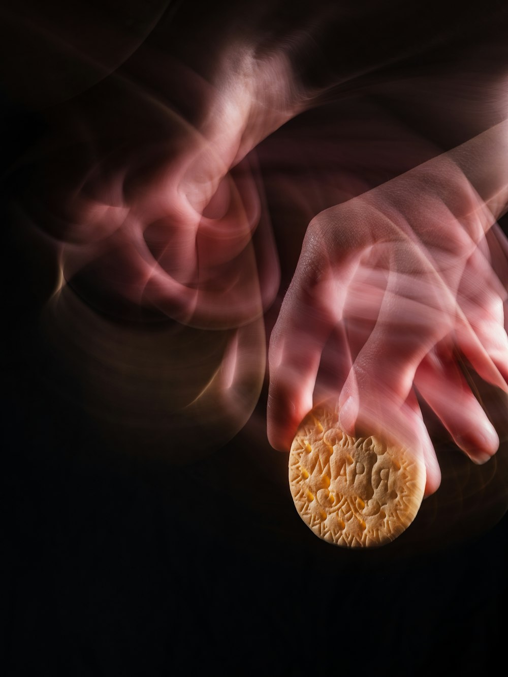 a close up of a person's hand holding a piece of food