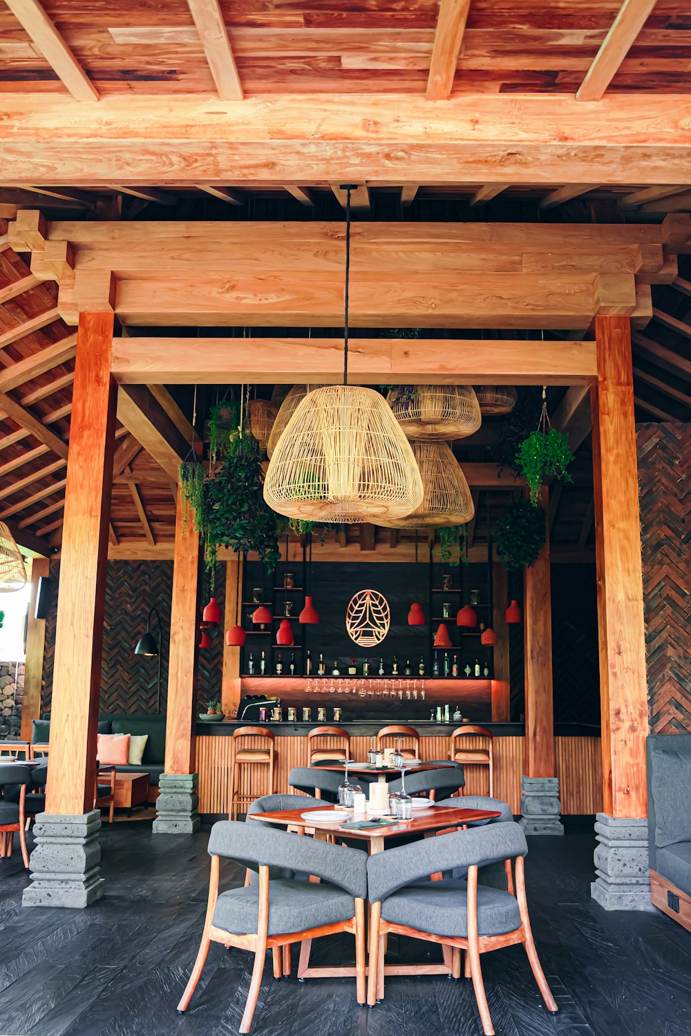 a restaurant with wooden tables and chairs