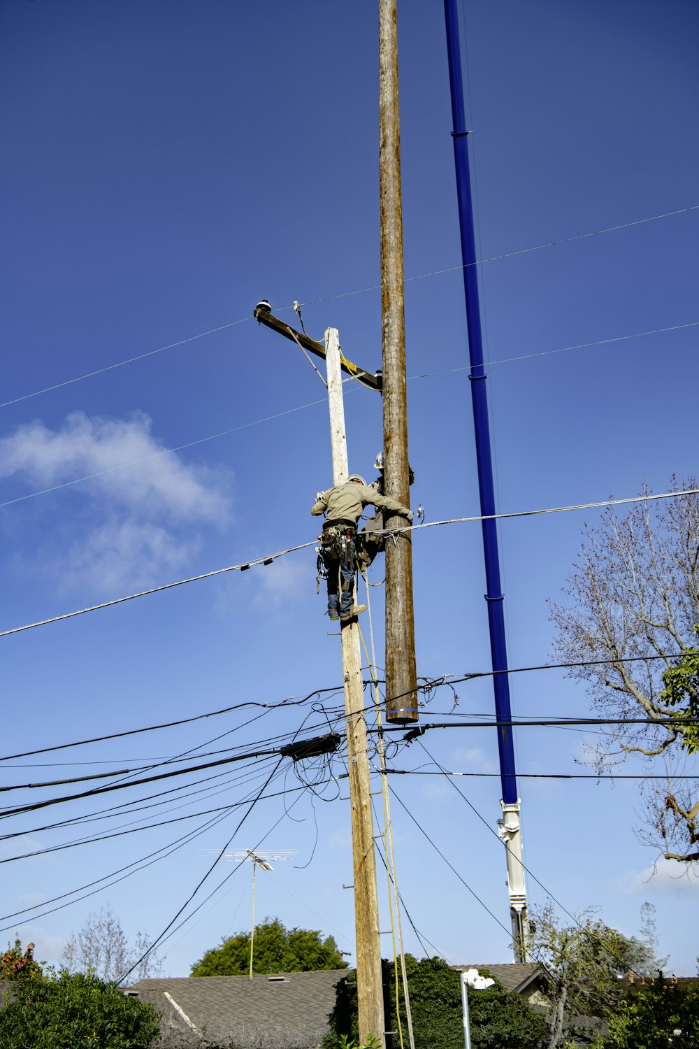 a telephone pole that has been knocked over by a power line