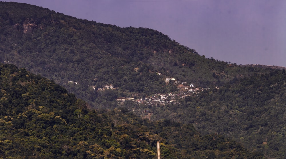 a view of a town nestled on a mountain