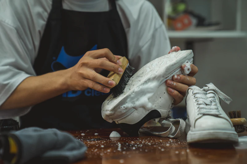 Trainer being cleaned by hand