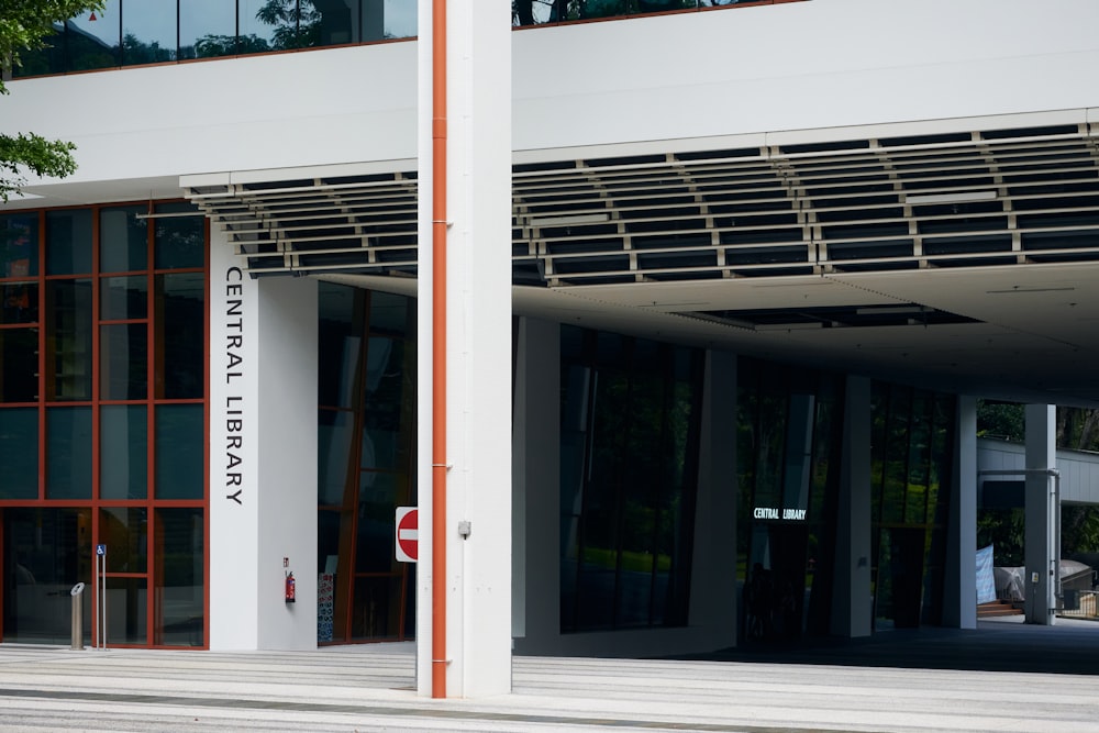 a white building with a red stop sign in front of it