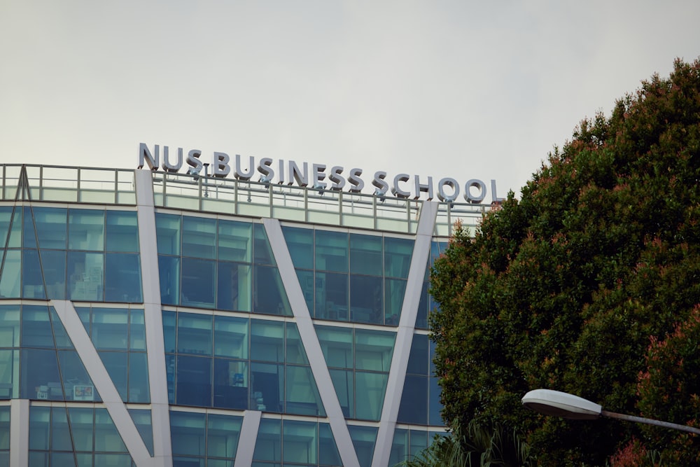 a tall building with a sign on top of it