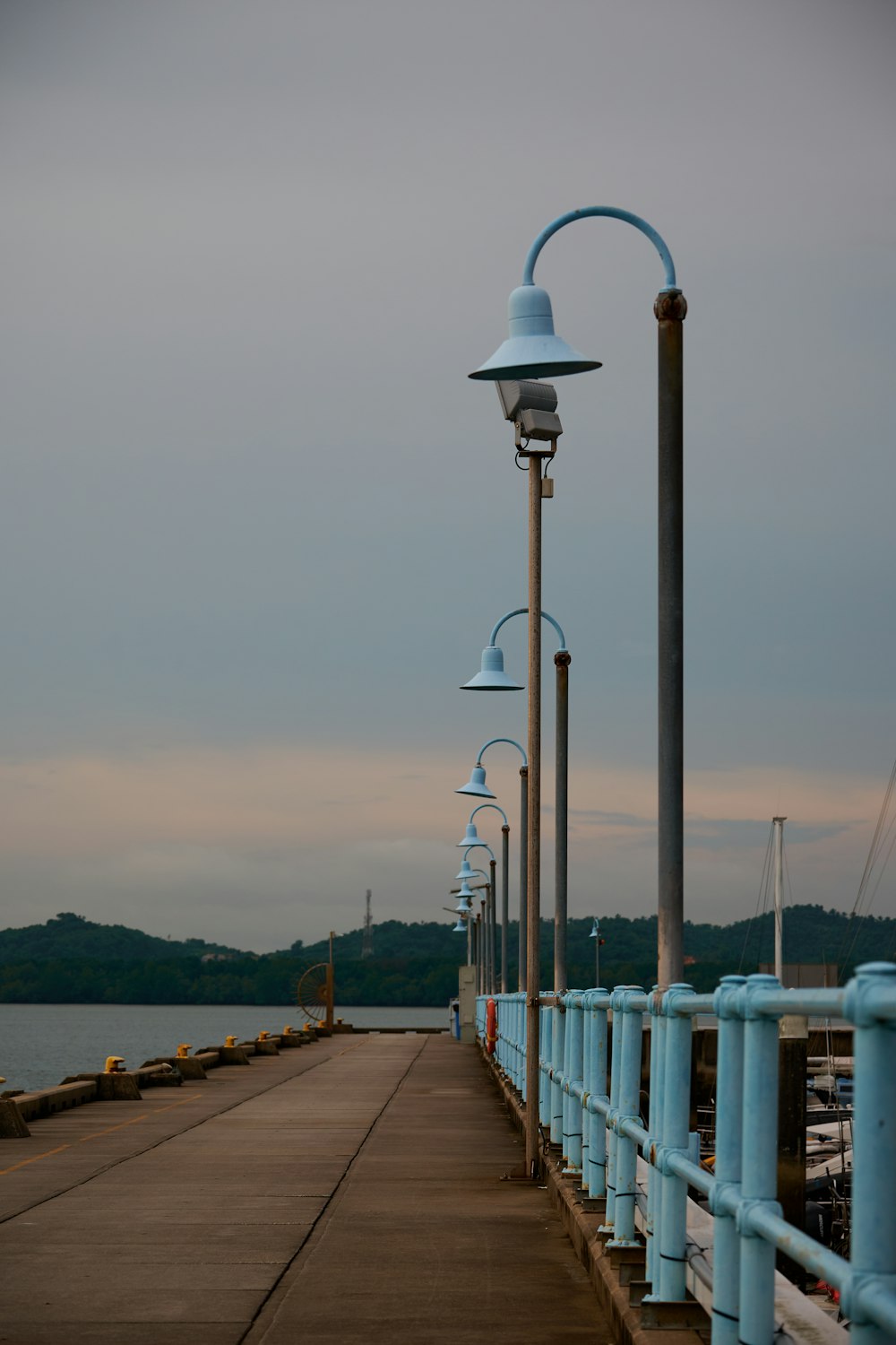 a pier with a light pole and a lamp post