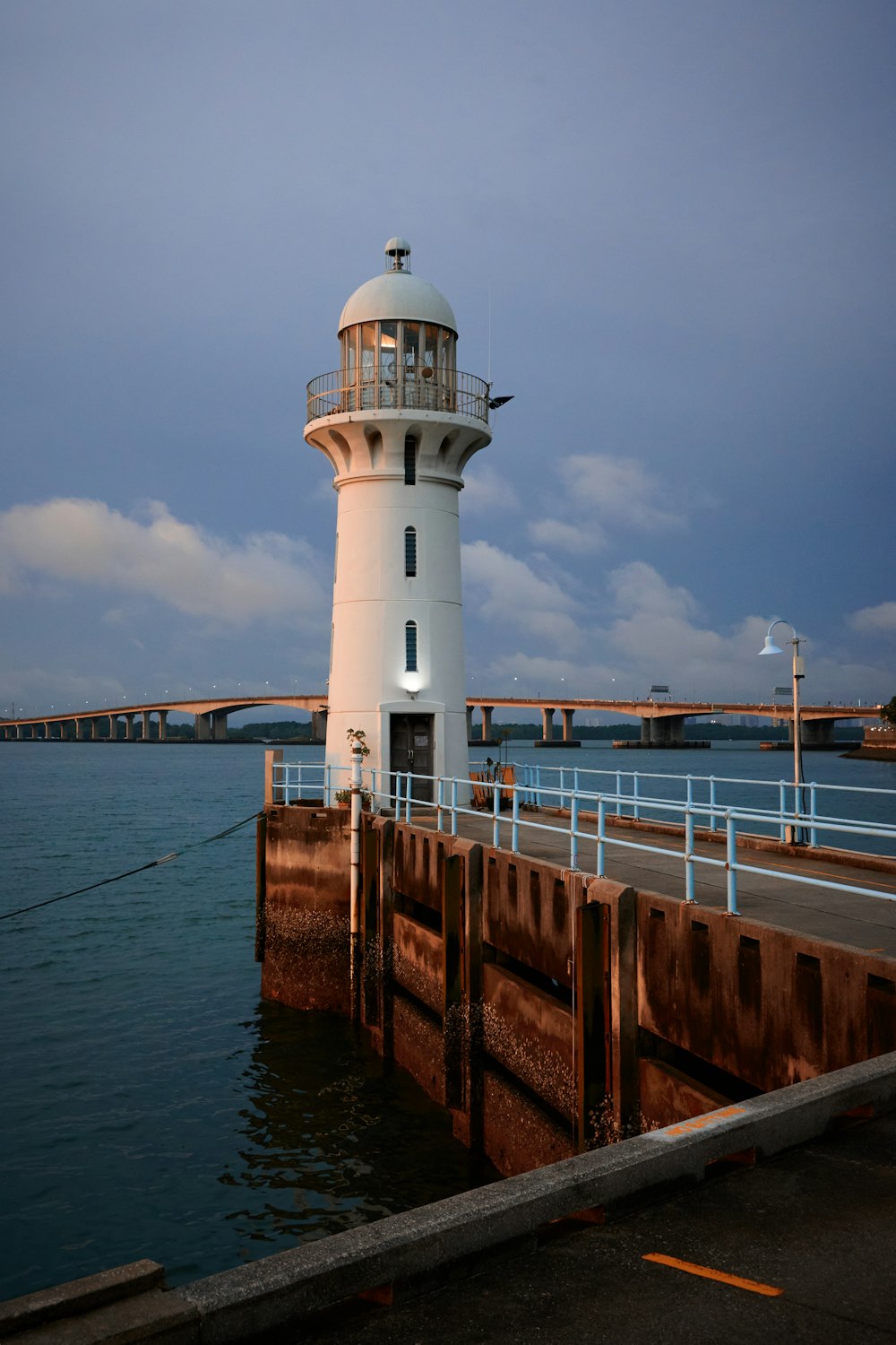 a light house sitting on top of a pier