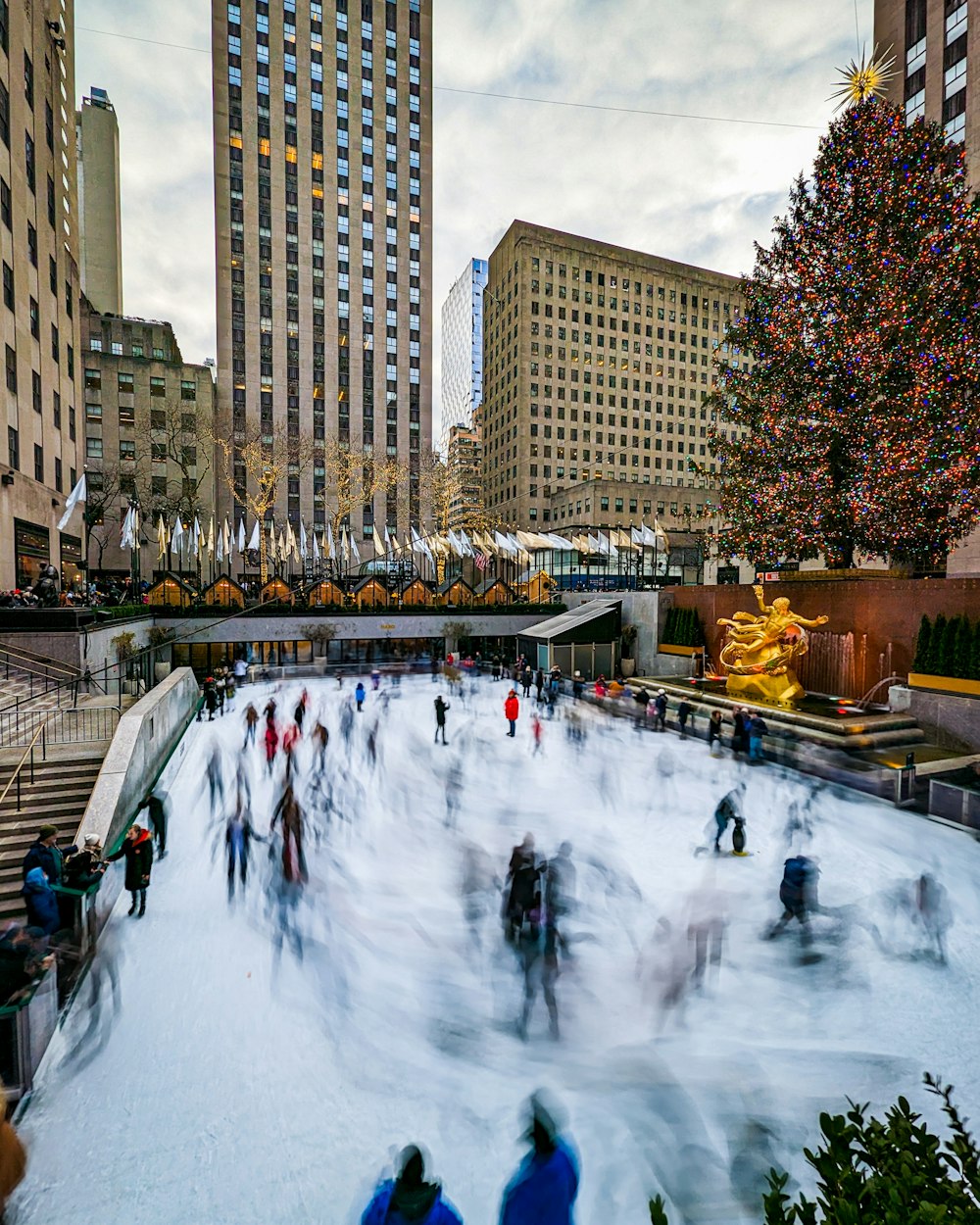 a group of people skating on an ice rink