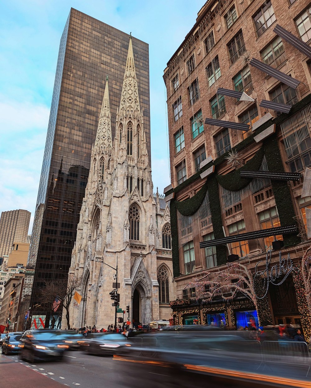 a large cathedral towering over a city filled with tall buildings