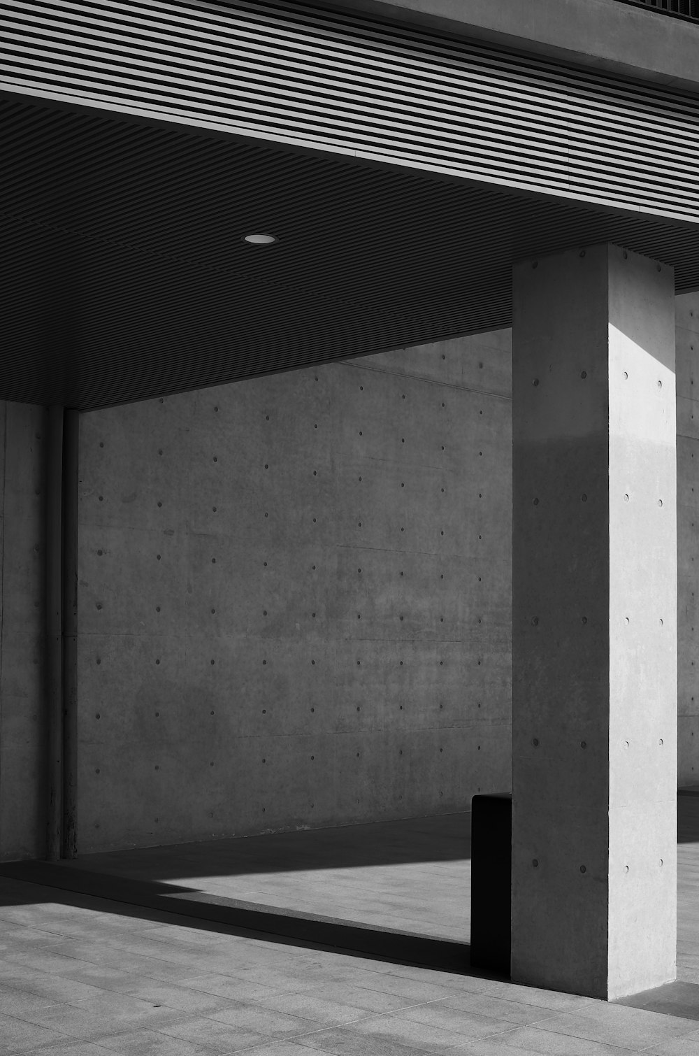 a black and white photo of a parking garage