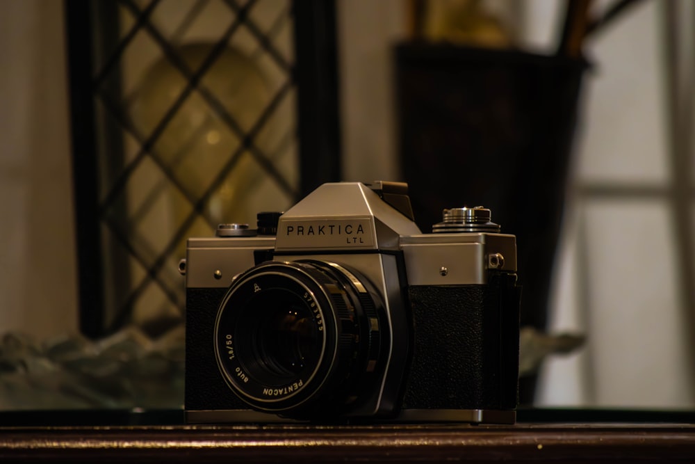 a camera sitting on top of a wooden table