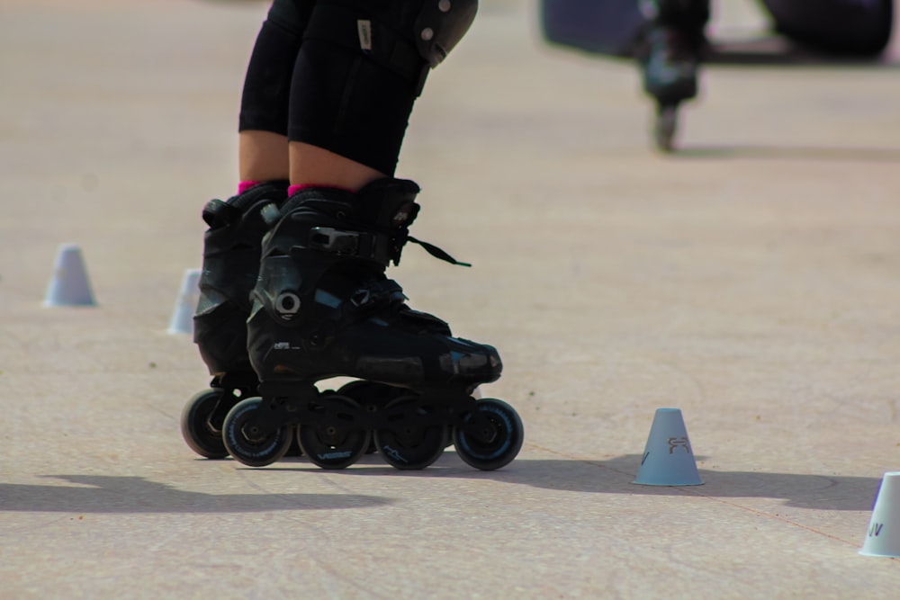 a close up of a person riding roller skates