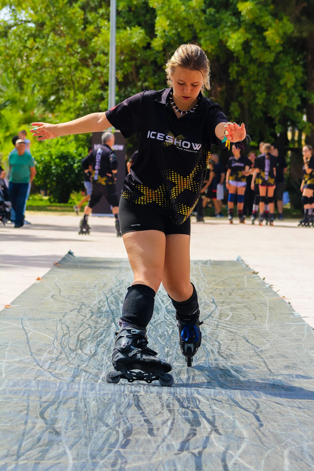 a woman riding a skateboard down a ramp