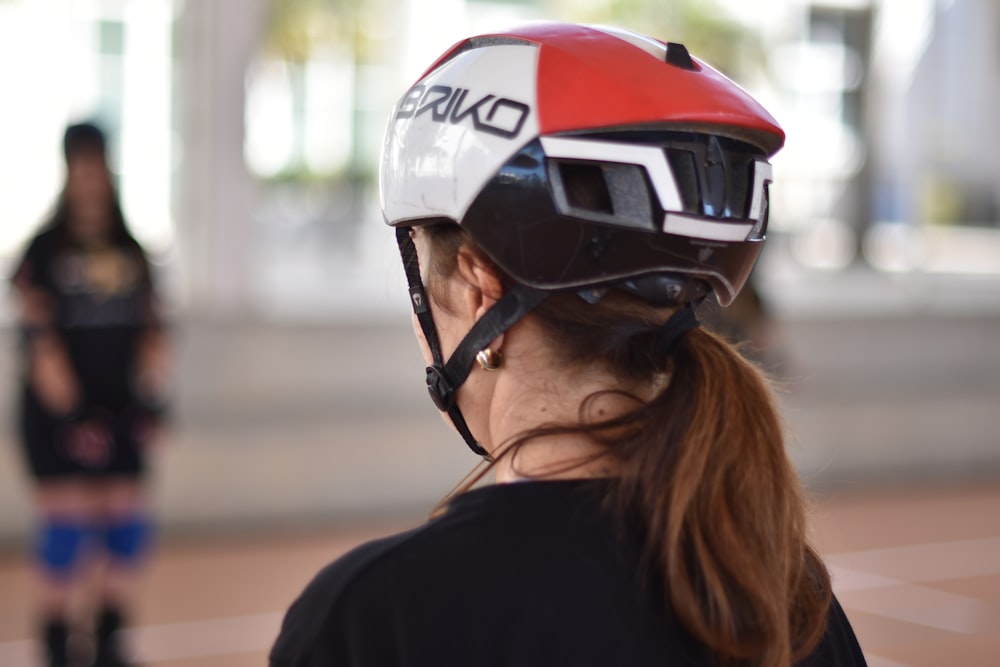 a woman wearing a helmet and roller blades