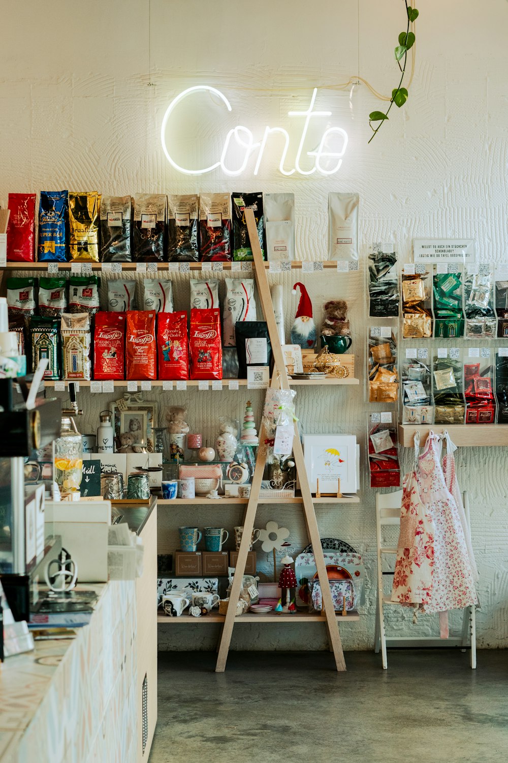 a store filled with lots of items and a neon sign