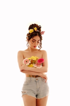 a woman with a bunch of flowers in her hair