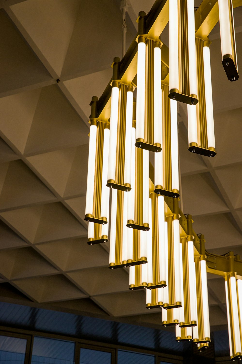 a chandelier hanging from a ceiling in a building