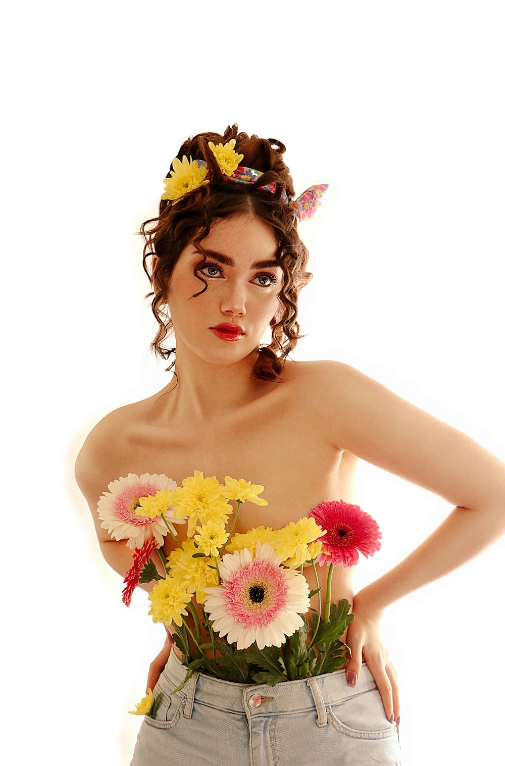 a woman wearing a butterfly headband holding a bouquet of flowers