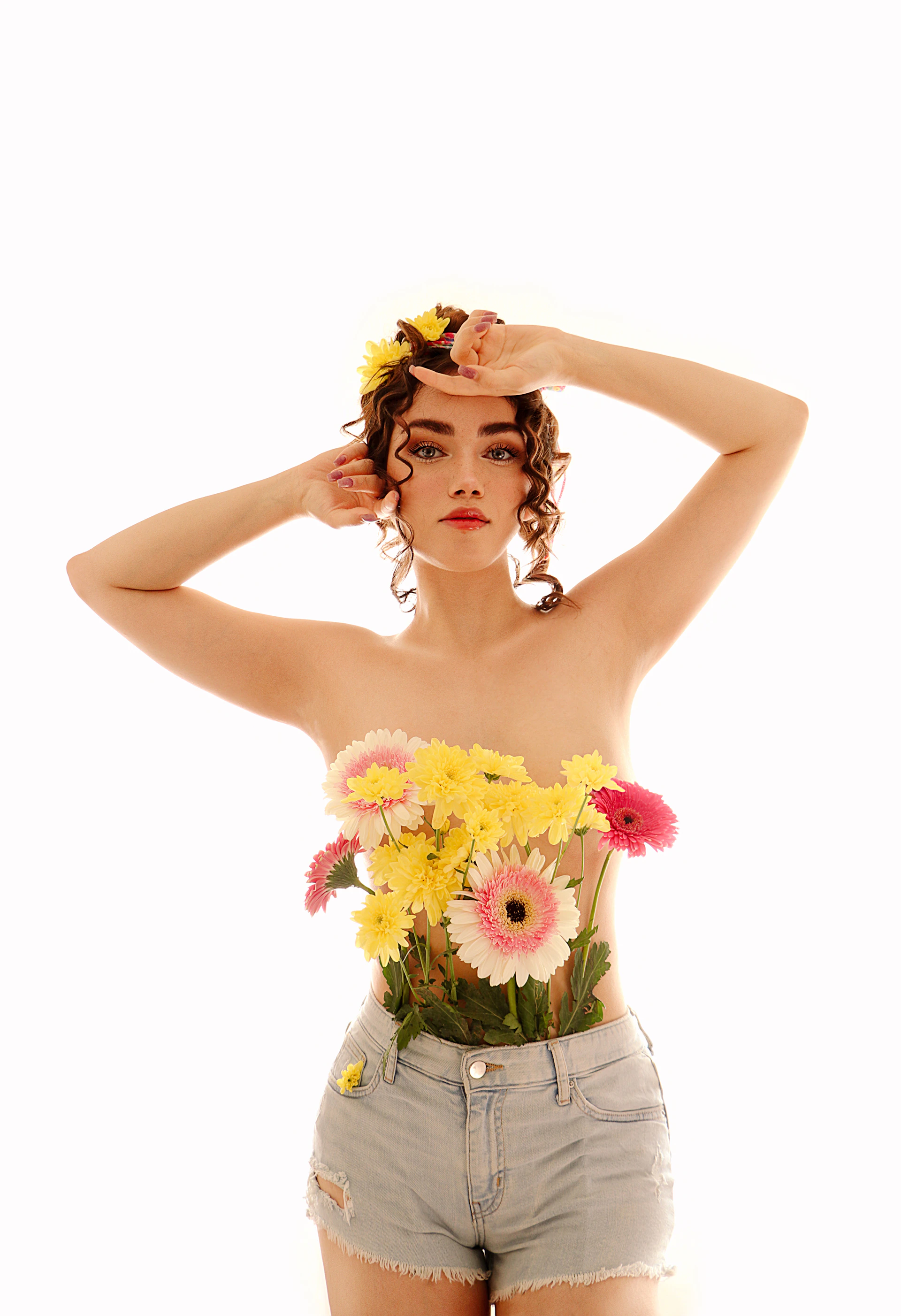 a woman with a bunch of flowers on her head