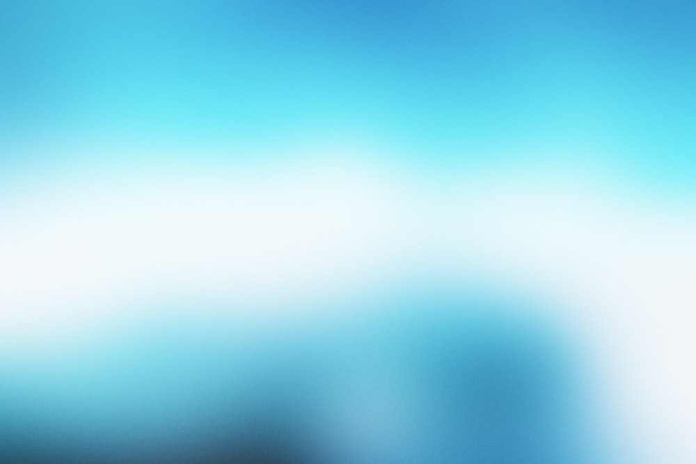 a blurry image of a blue and white background