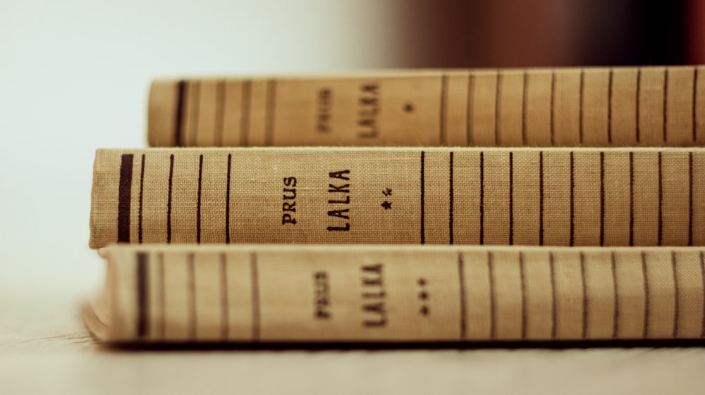 a close up of three books on a table