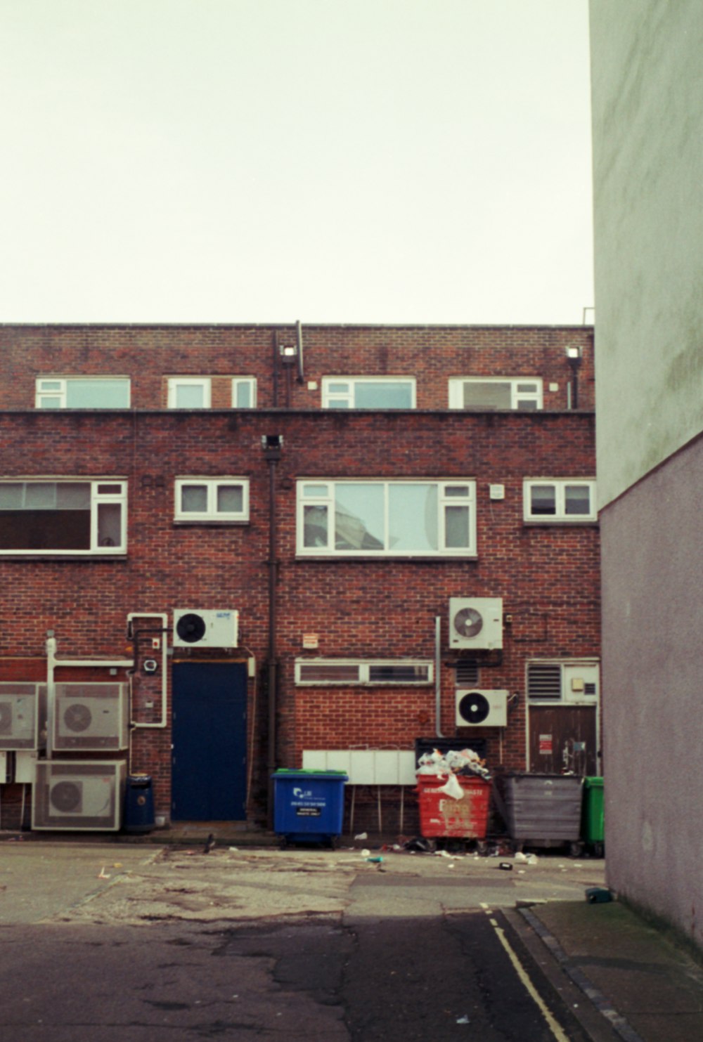 an empty street in front of a brick building