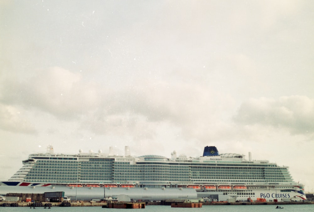 a large cruise ship docked in a harbor