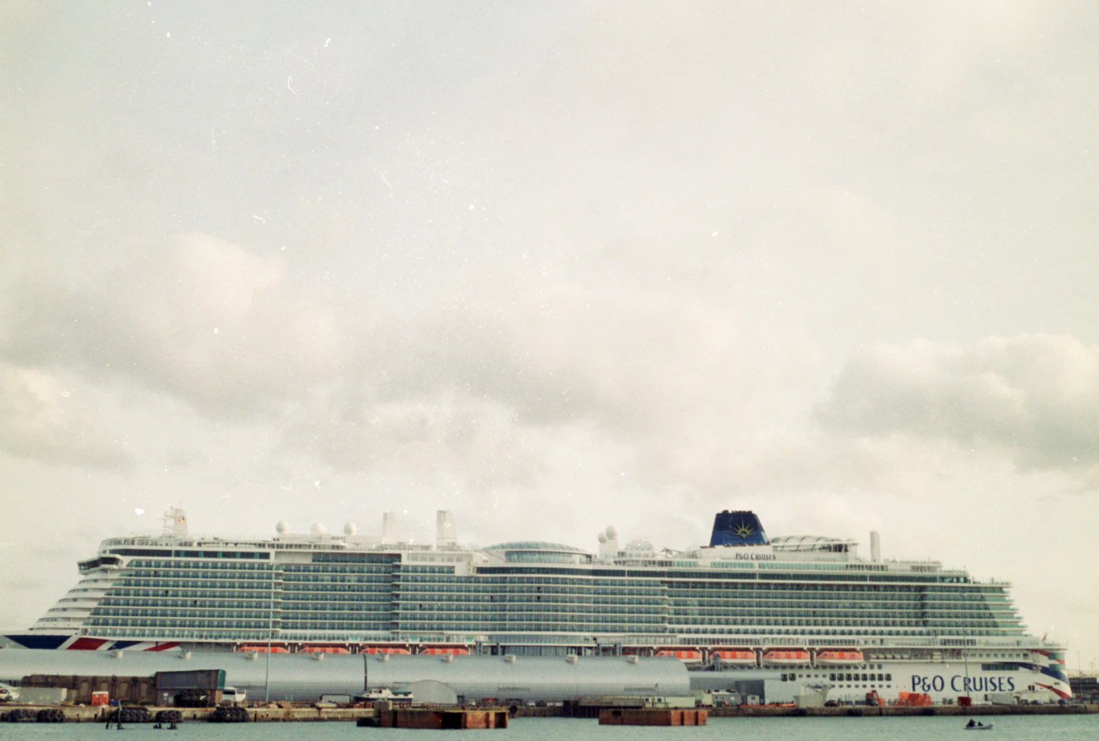 Large cruise ship docked in a harbour