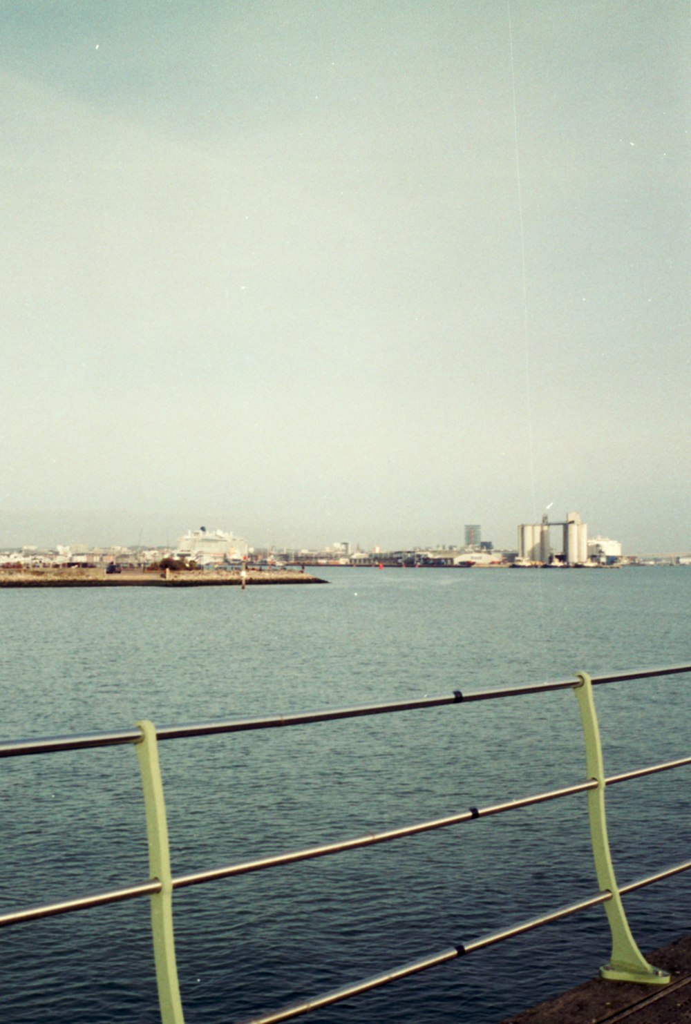 a view of a body of water with a city in the background