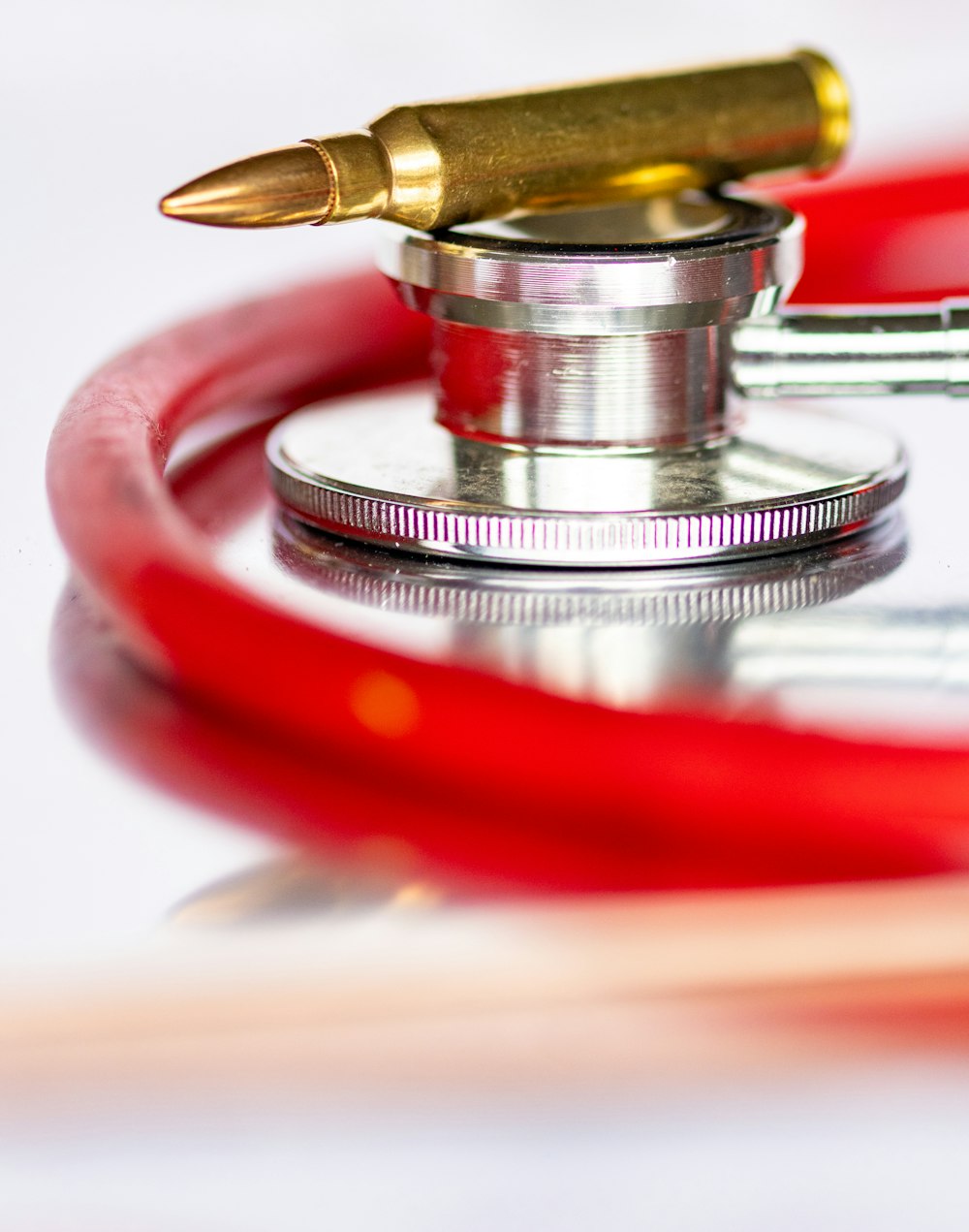 a close up of a stethoscope with a pen on top of it