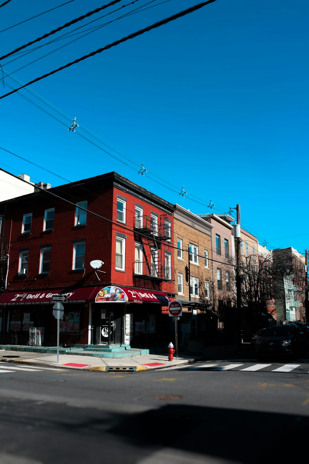 a red brick building sitting on the corner of a street