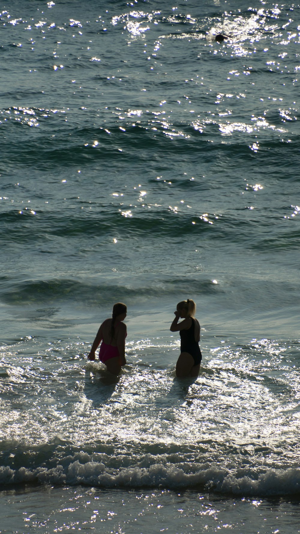 a couple of people that are in the water