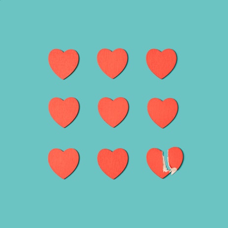a group of red hearts cut out of paper
