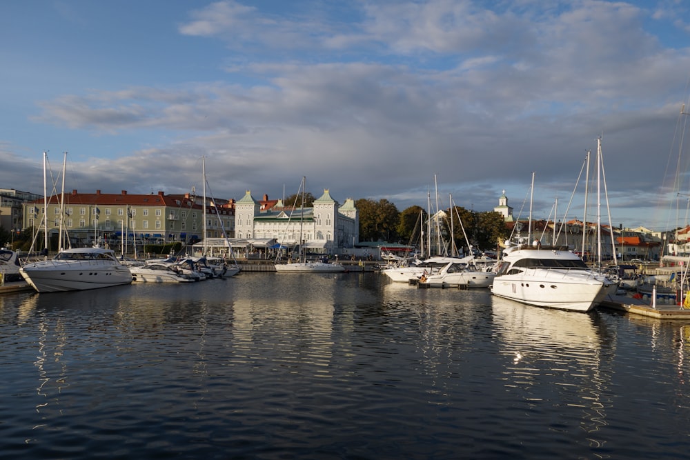 a harbor filled with lots of boats under a cloudy sky