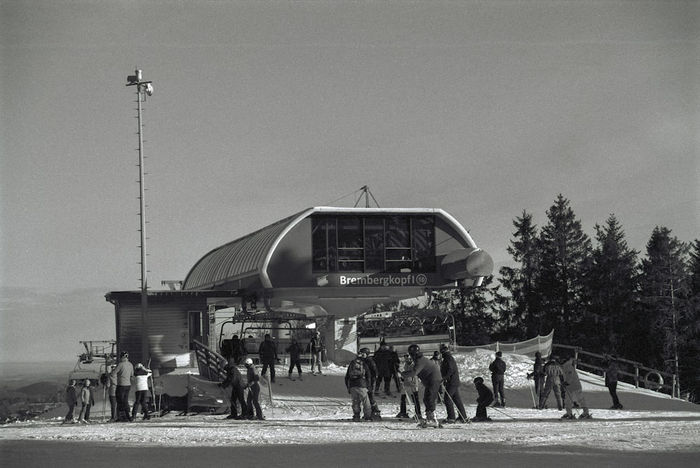 a group of people standing outside of a building