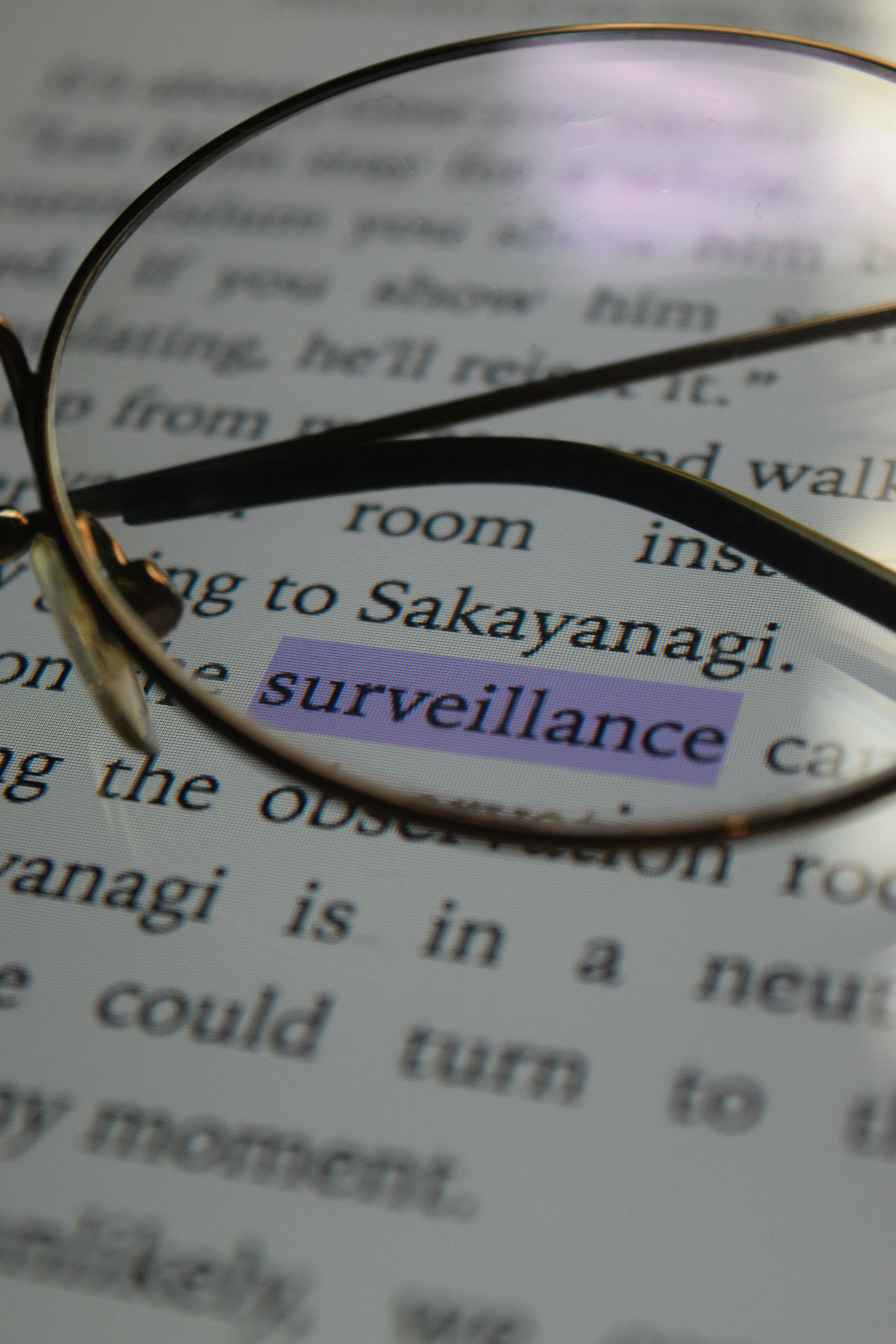 a pair of glasses sitting on top of a book