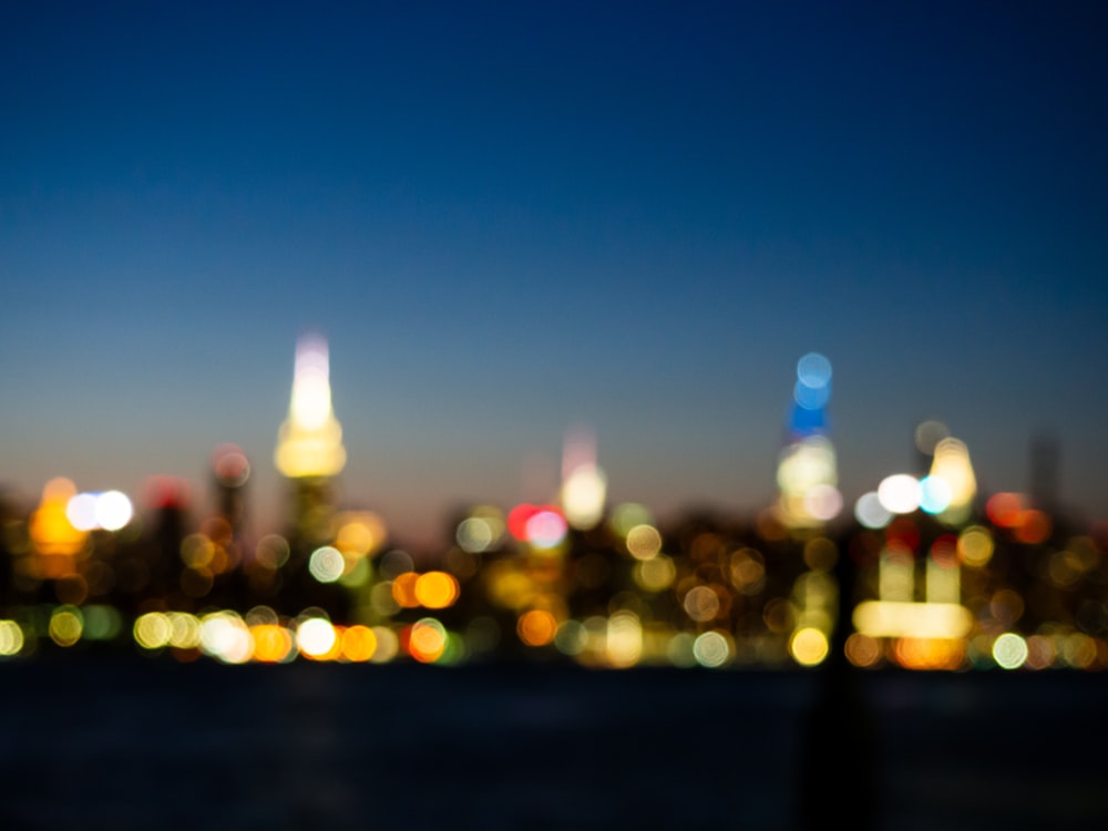 a blurry photo of a city at night