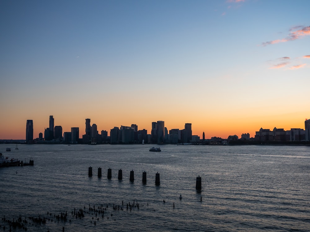 a large body of water with a city in the background