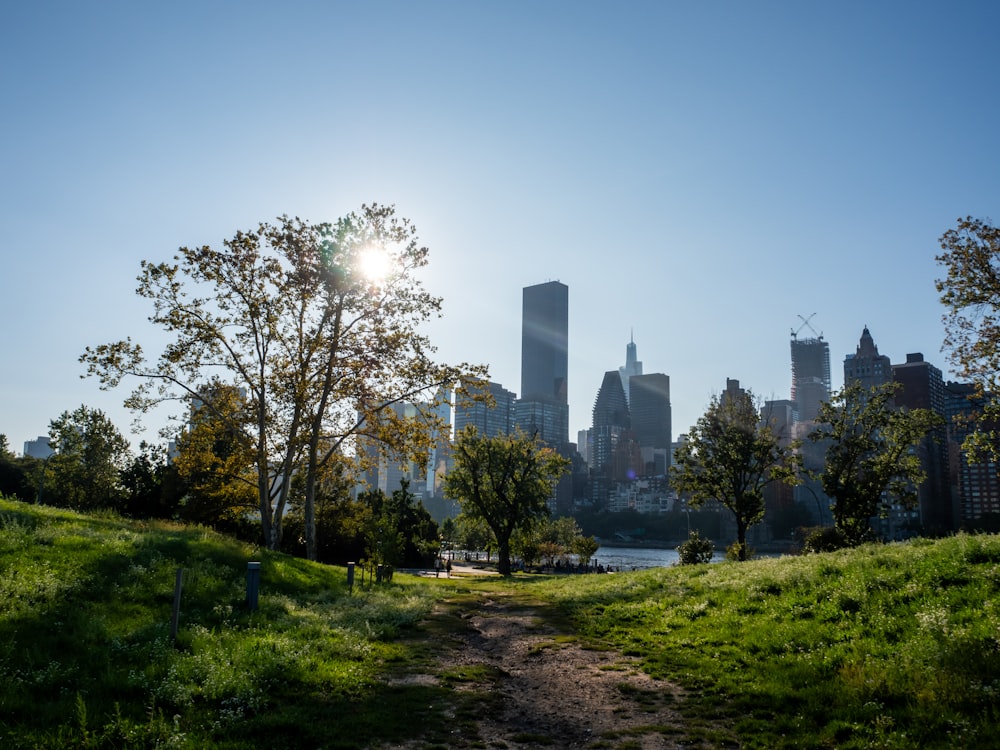 the sun shines brightly over the city skyline