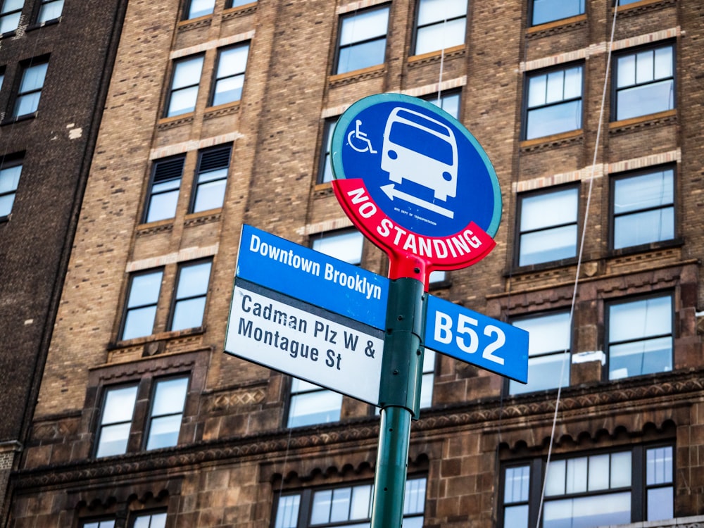 a street sign in front of a tall building