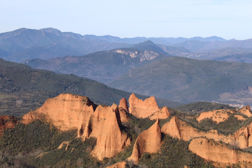 a view of a mountain range with mountains in the background