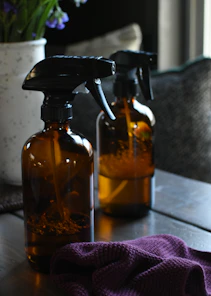 a couple of bottles sitting on top of a wooden table