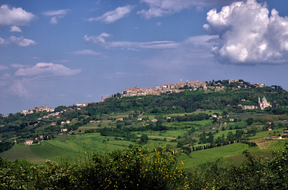 a hill with a village on top of it