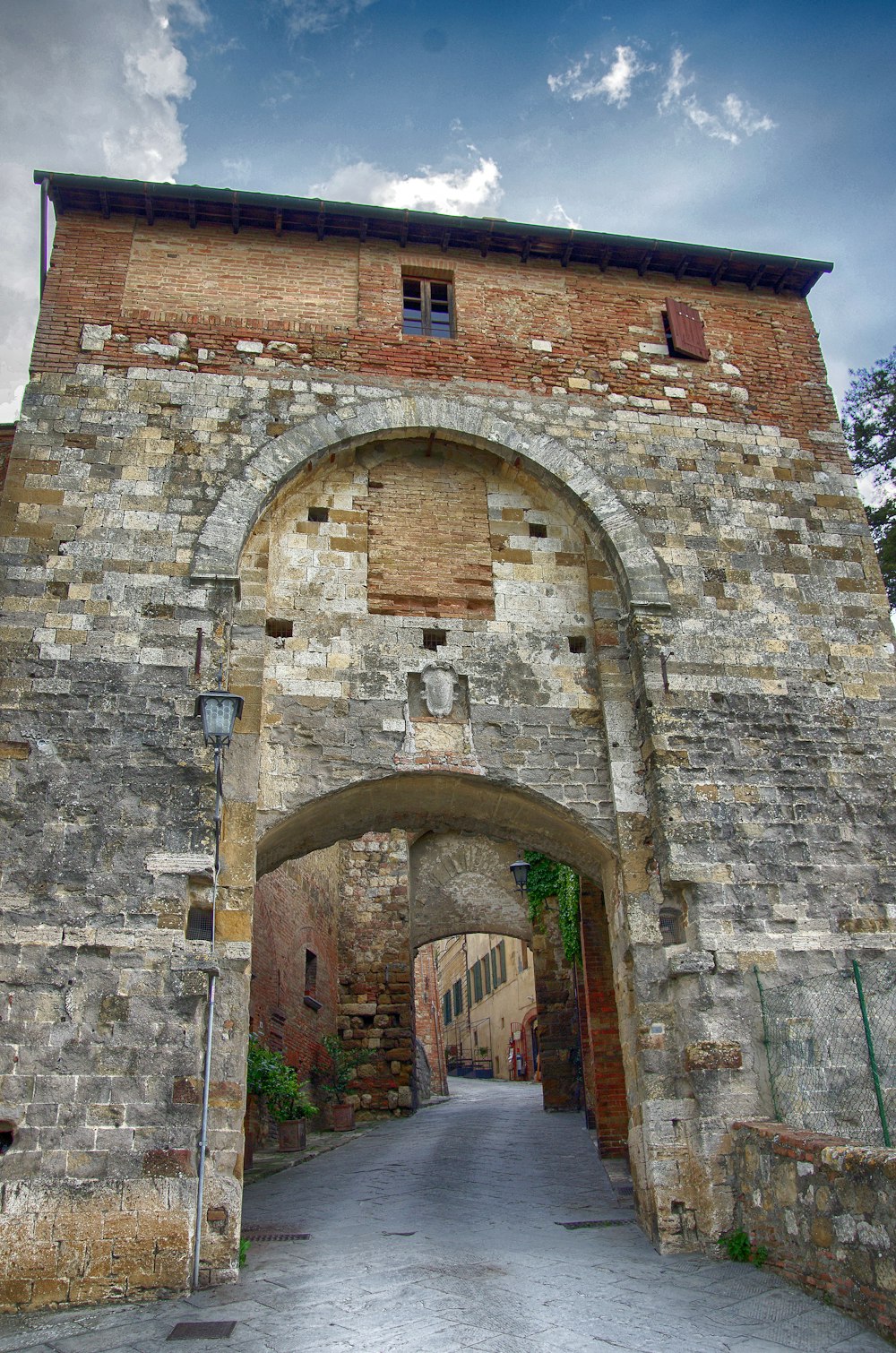 an old brick building with an arched doorway
